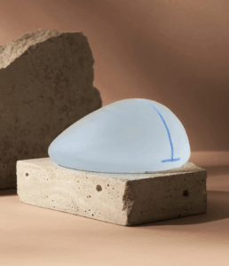 Why Dr Carmen Chooses Motiva Implants Blog on Dr Carmen Munteanu Site - Motiva Breast Implant Above a Block of Stone